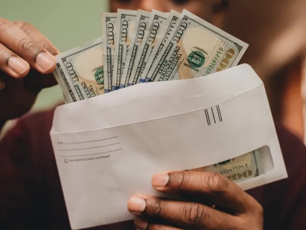 african-american-man-counting-one-hundred-dollar-b-2024-11-01-02-33-26-utc1-684e00faade07