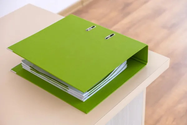 green-binder-with-office-documents-on-a-working-ta-2024-12-06-01-42-37-utc1-684df55b148e6